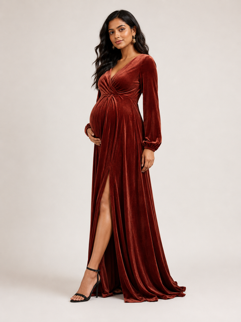 Woman wearing a rust-colored 4-way poly lycra gown with long sleeves and a high slit on a white background