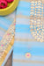 Close-up of Gota Patti Handwork Design on Blue Kota Doria Fabric.