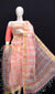 Model showcasing peach Kota Doria Gota Patti dress material with gold and green floral embroidery.