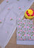 Complete set of Embroidered Kota Doria Dress Material in grey, including embroidered top, dupatta, and plain cotton bottom fabric, beautifully arranged with floral decor.