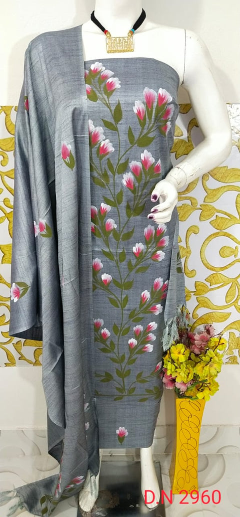 Grey Hand-Painted Matka Tussar Silk Dress Material with floral motifs, matching dupatta, and plain bottom fabric. Ideal for formal, festive, and casual occasions.