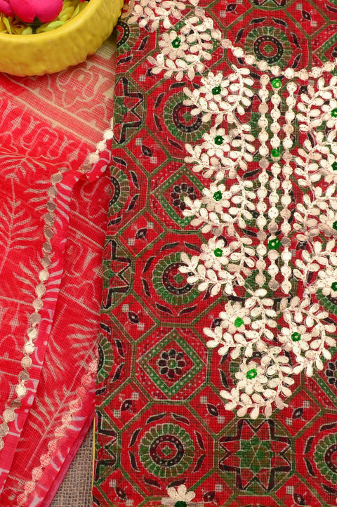Close-up of Gota Patti embroidery on red and beige Kota Doria fabric, showcasing fine craftsmanship.