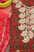Close-up of Gota Patti embroidery on red and beige Kota Doria fabric, showcasing fine craftsmanship.
