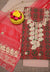 Flat lay of the unstitched Kota Doria Gota Patti suit set featuring red and beige fabric with floral embroidery.