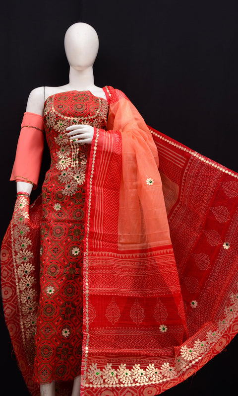 Kota Doria Gota Patti Suit Set in red and peach combination displayed on a mannequin with intricate embroidery.