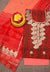 Flat lay of the unstitched Kota Doria Gota Patti suit set in red and peach with floral embroidery.