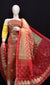 Kota Doria Gota Patti Suit Set in red and yellow combination with intricate embroidery displayed on a mannequin.