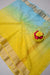 Open view of the saree highlighting its vibrant yellow and sky blue double dye design.
