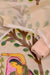 Close-up of beige Rajasthani Kota Hand Painted Suit showcasing intricate cultural motifs.
