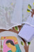 Close-up of Rajasthani Kota Doria fabric with hand-painted design in grey.