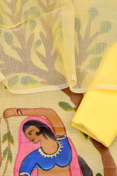 Close-up of yellow Rajasthani Kota Hand Painted Suit with intricate motifs and soft fabric.