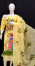 Rajasthani Kota Hand Painted Suit in yellow displayed on a mannequin, showcasing its cheerful color and craftsmanship