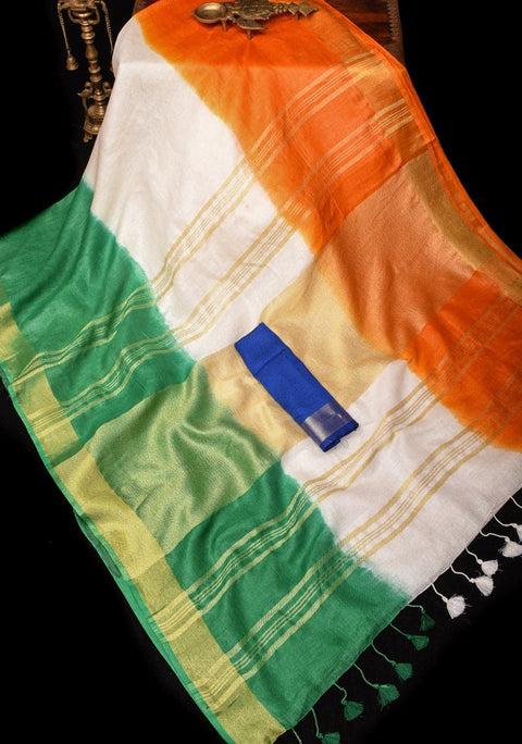 Sari with green, white, and orange colors on a dark background